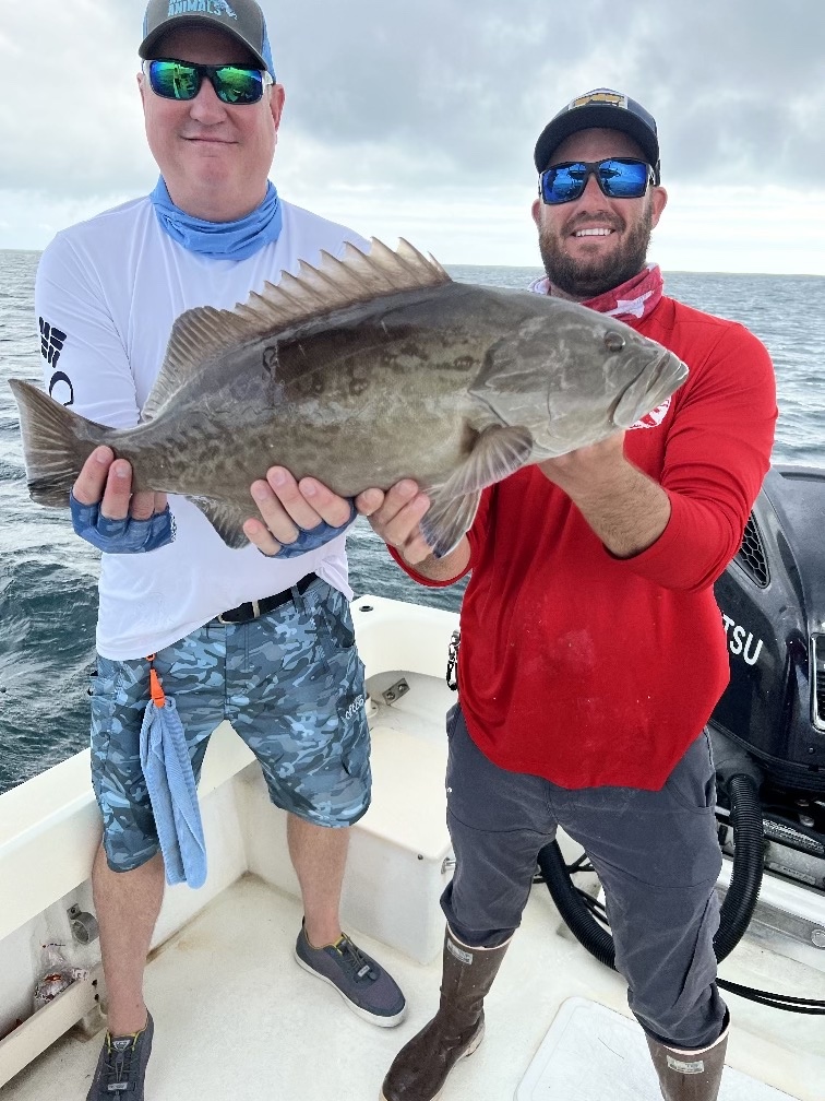 Fishing photo - Captain Jon Helping A Customer With A Gag Grouper.